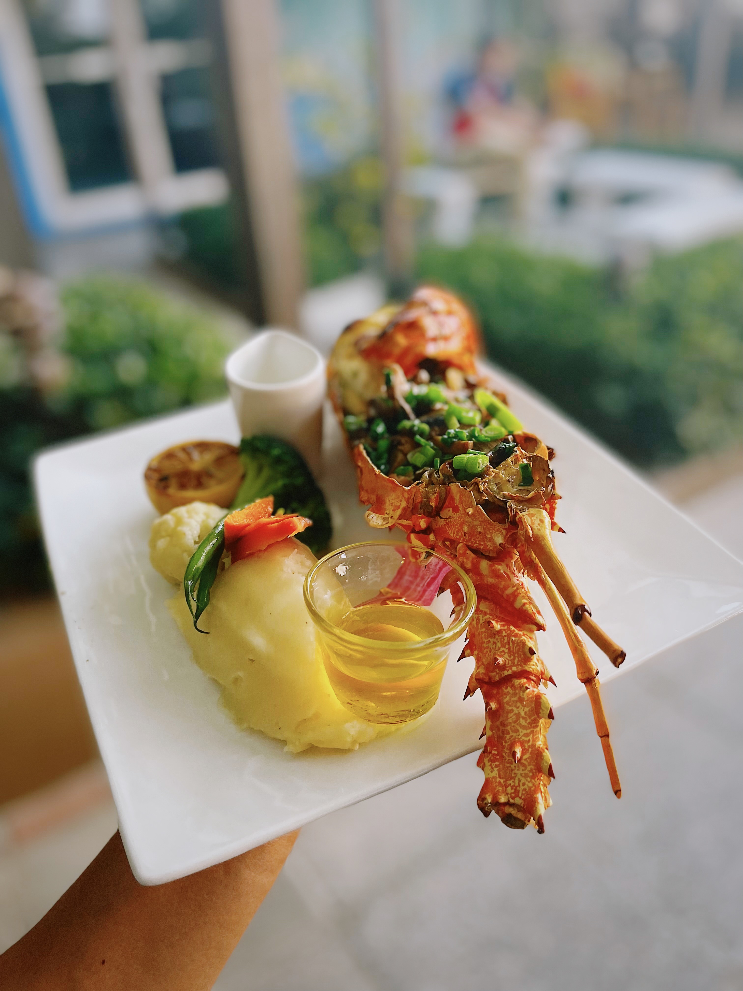 Reviews of Excellence: The Wharf Features in the Caymanian Times